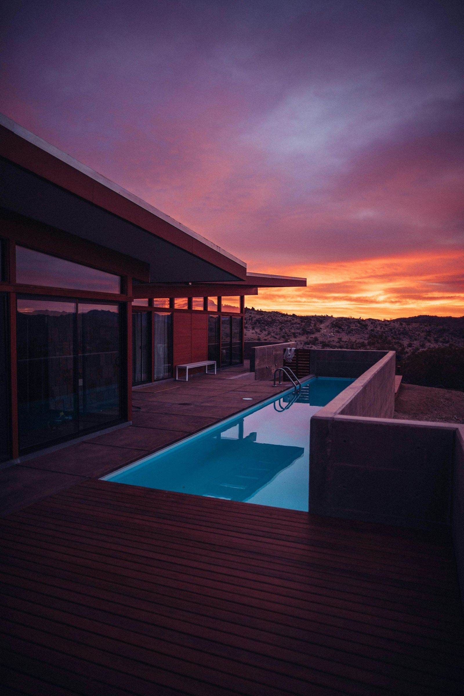 Home during golden-hour light with an installed Acuasol solar water heater on the roof
